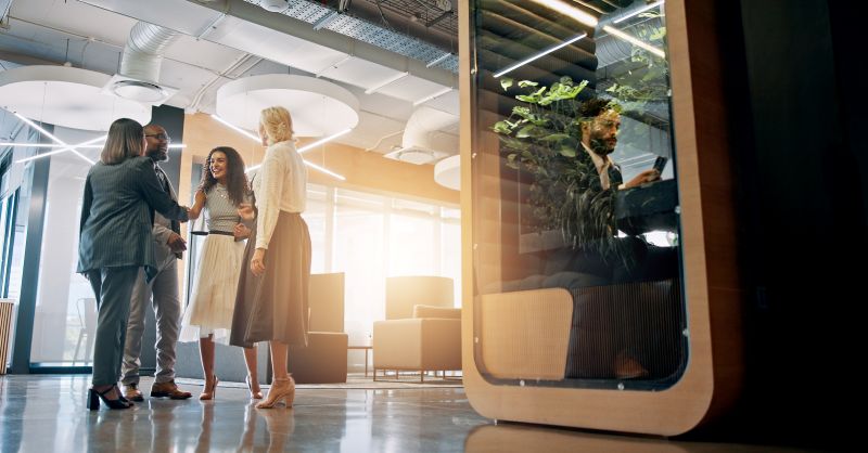 Lobby, corporate and business people with cubicle in office for coworking space for collaboration, teamwork and meeting.